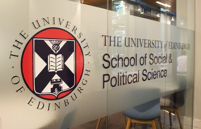A sign reading School of Social & Political Science