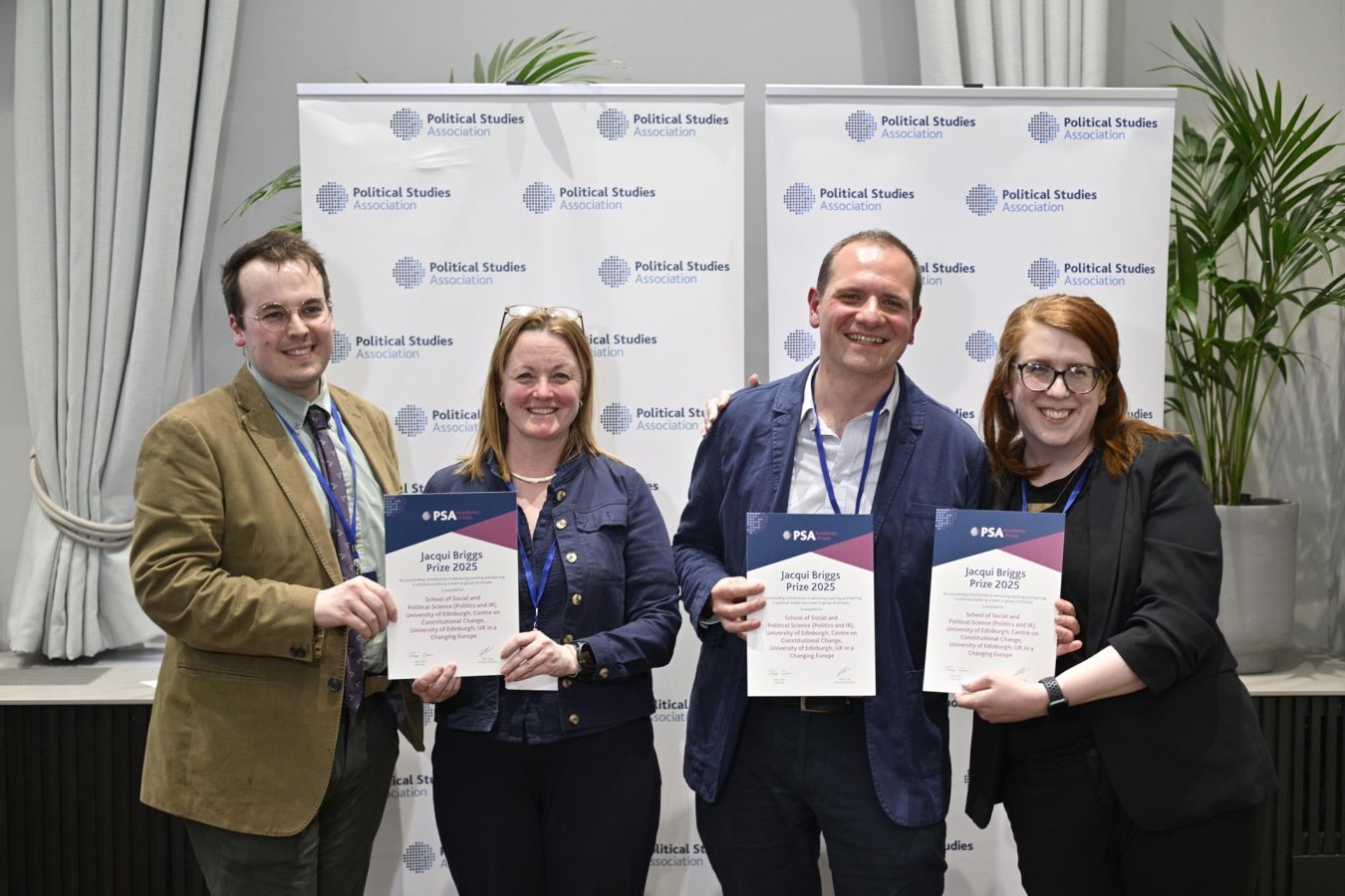 Photo of four SPS academics - Fraser McMillan, Ailsa Henderson, Davide Vampa and Meryl Kenny - with their prizes