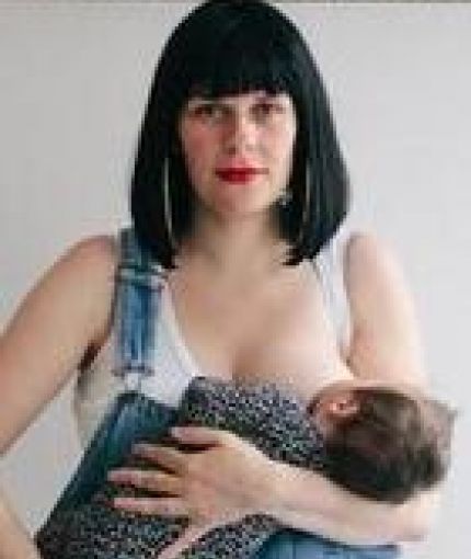 Lucy Lowe breastfeeding her baby.
