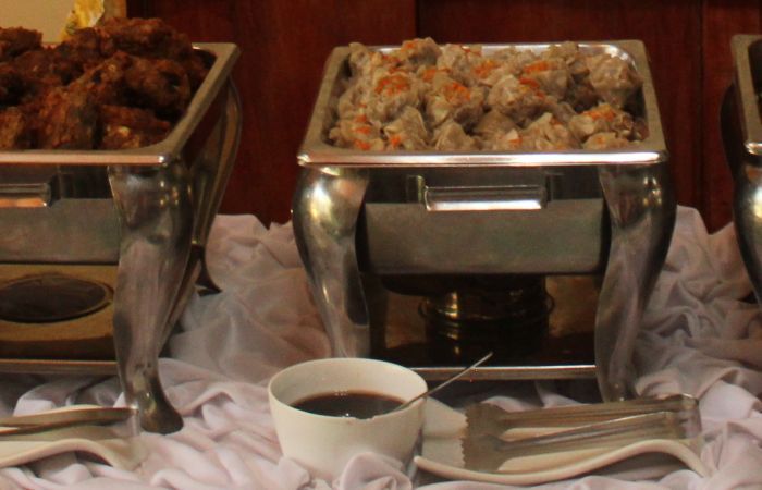 A photo of catering trays with food